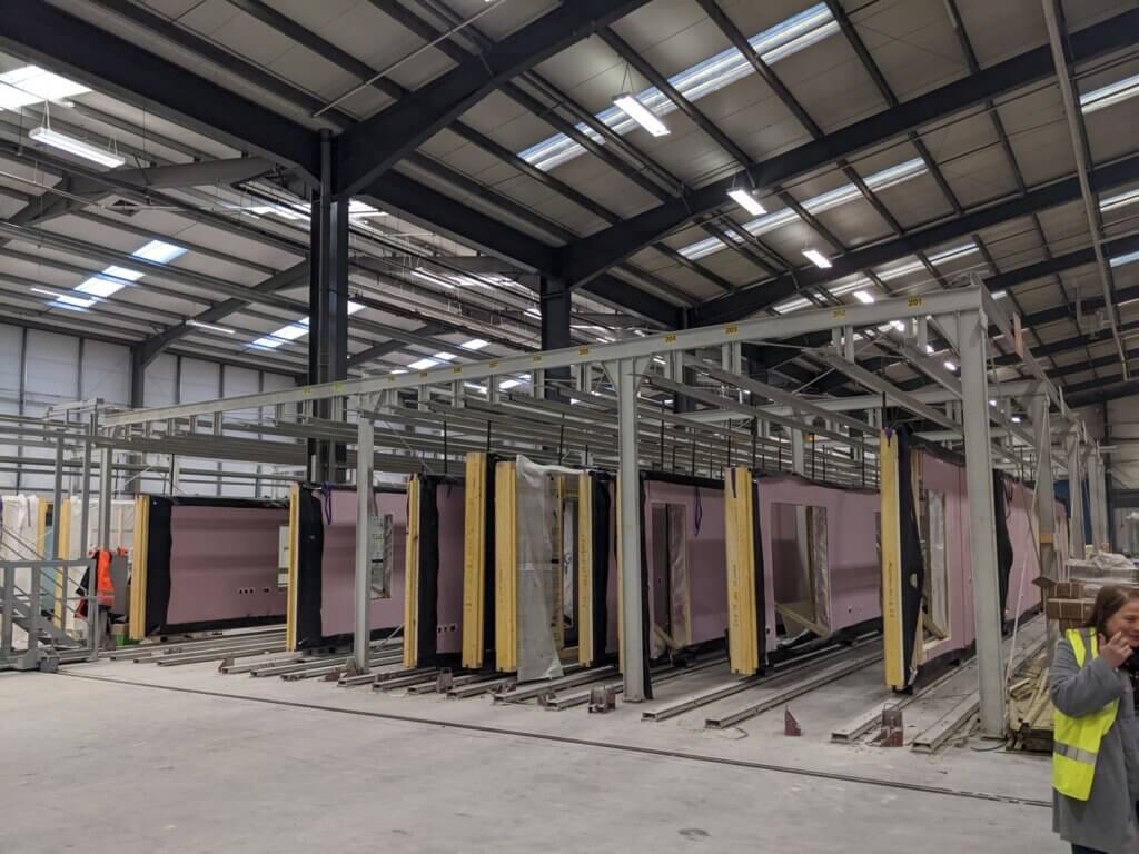 Photo of factory floor with panels under construction