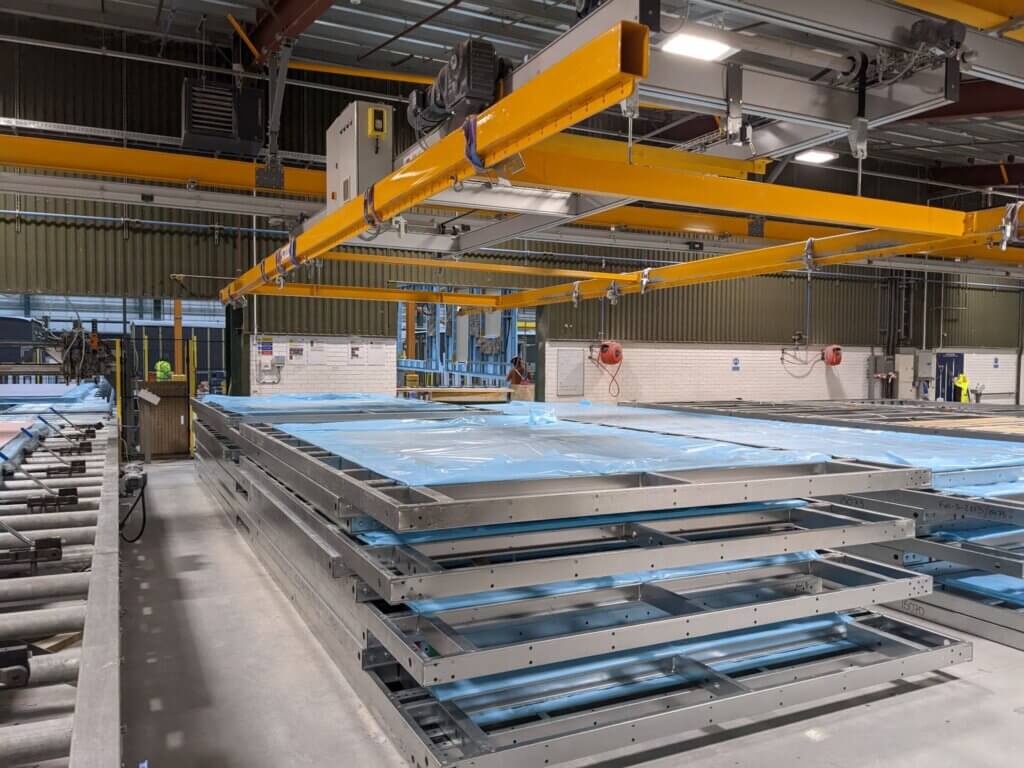 Photo of a stack of steel panels in factory